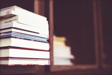 Books are placed on bookshelf in a library. education concept. with filter Tones retro vintage warm effect.