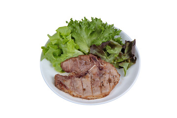 Pork Chop Steak served with mixed vegetable as red oak , green oak and lettuce