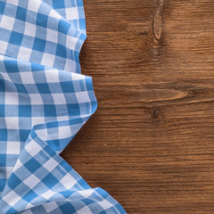 Tablecloth textile on wooden background 

