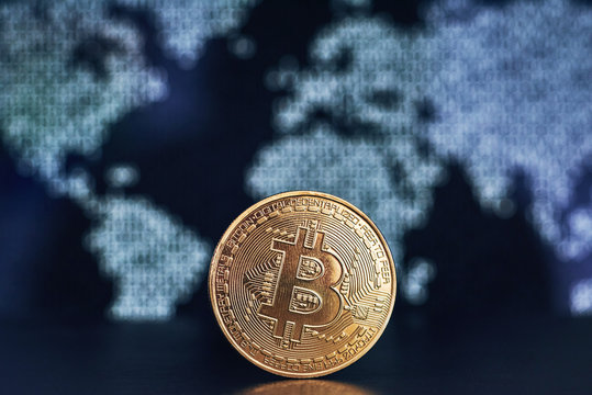 Bitcoin on world map background