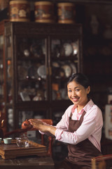 Smiling girl at tea ceremony