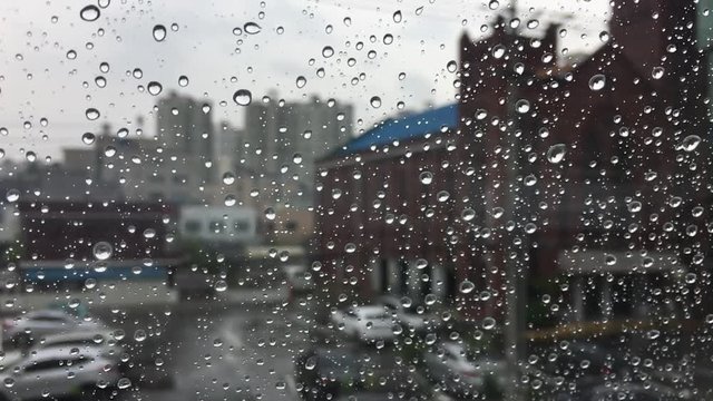 Raindrops on the window, rainy day.