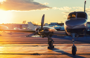 Small Aviation: Private Jet is Parked on a Tarmac in a Beautiful - Powered by Adobe