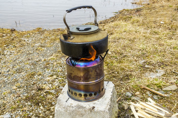 Camping wood gas stove with a kettle