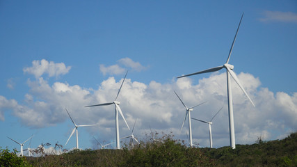 Windmills for electric power production. Bangui Windmills in Ilocos Norte, Philippines. Solar farm, Solar power station.