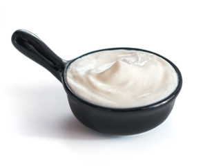 Fototapeta na wymiar Bowl of sour cream isolated on white background
