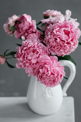 Bouquet of pink peonies in a jug