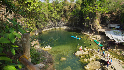 Fototapeta premium Waterfall in green rainforest. Bolinao waterfall in the mountain jungle. Philippines, Luzon. Travel concept.