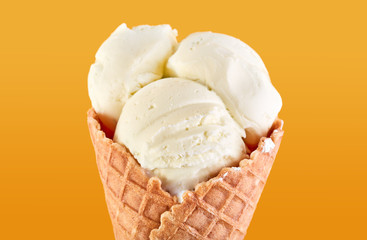 ice cream balls with colored sugar sprinkles in a Waffle Cone on a yellow Background. Vanilla ice cream in a waffle cone.