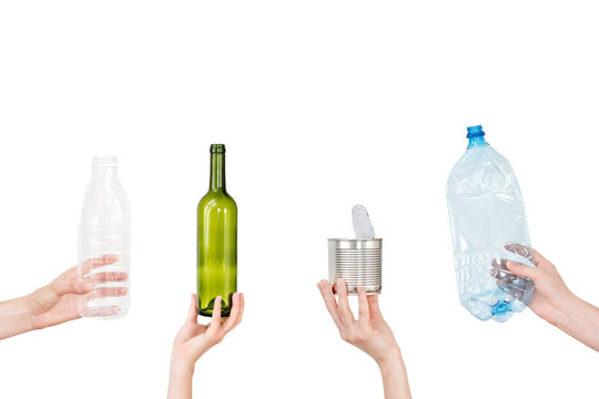 Female hand holding empty glass bottle isolated on white. Recyclable waste. Recycling, reuse, garbage disposal, resources, environment and ecology concept
