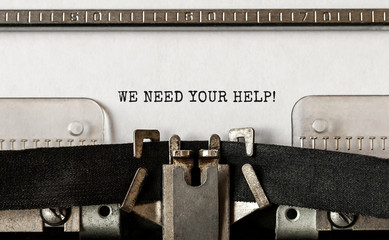 Text We Need Your Help typed on retro typewriter © Studio Nova