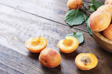 scattered apricots on a wooden background