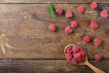 fresh raspberries in a spoon