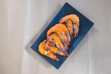 Grilled shrimp served in a black plate