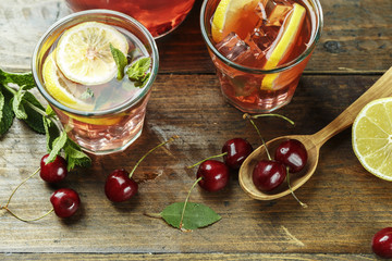 cups with a cherry drink