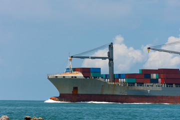 Cargo container ship carrying container import and export  goods running around container yard port...
