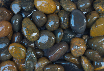 The river rocks from nature on a black background.