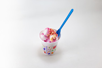 Mixed ice cream in sundae cup on white background isolate