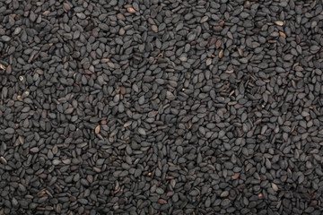 Black sesame seeds isolated on white background top view