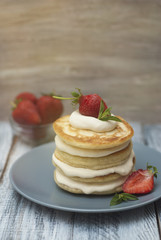 Dessert Pancakes with Cream and Strawbery. Health Breakfast Fruit Berry Vitamine Gray Rustic Wooden Background