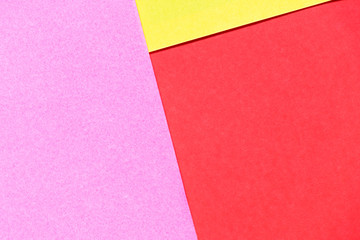 Pink, red and yellow color paper display as abstract blank background