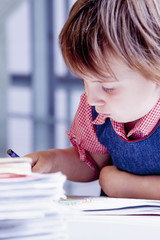 Little business girl working in an office. Humorous picture.