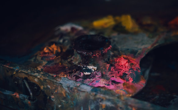 An artists with oil paints palette closeup