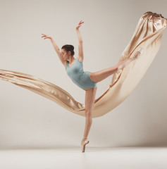Fototapeta na wymiar Modern ballet dancer dancing in full body on white studio background.