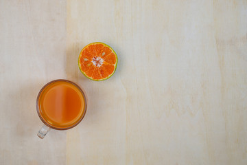 Obraz na płótnie Canvas Orange juice, Half cut orange on wood background