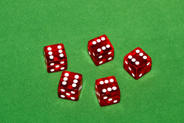 Casino. Red cubes on a green table