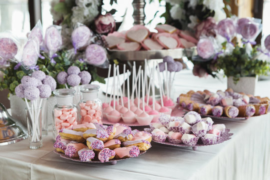 Dessert table for any holiday at wooden background