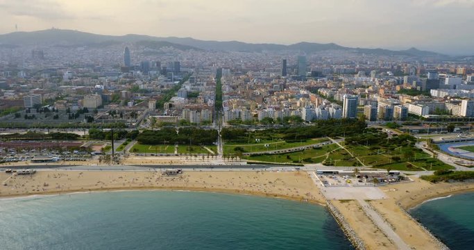Aerial view of Barcelona city skyline and the beach, Spain. Sunset light