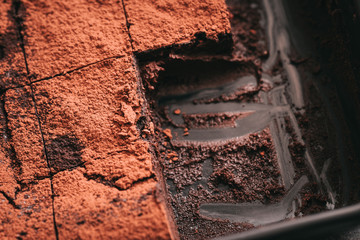 Decadent moist dark chocolate stout beer brownies cut in squares. Dark food photography concept