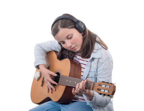 Smiling Teenager Girl Playing Acoustic  Guitar