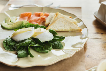 Healthy breakfast with poached eggs and smoked salm