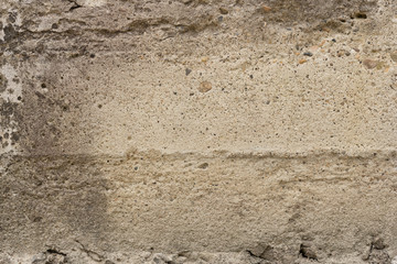 Wall fragment with scratches and cracks