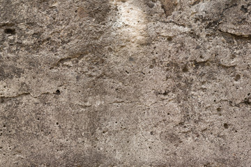 Wall fragment with scratches and cracks