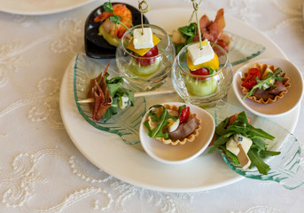 Delicious snacks served in small plates in the restaurant, seafood