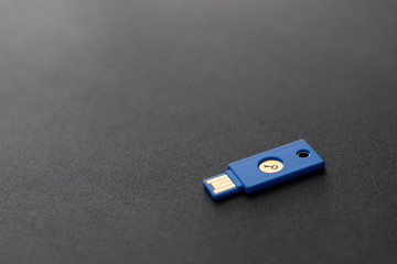 Security system concept. Key-shaped USB drive on dark background. Technology and data security...