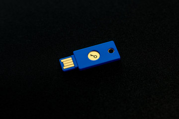 Security system concept. Key-shaped USB drive on dark background. Technology and data security...