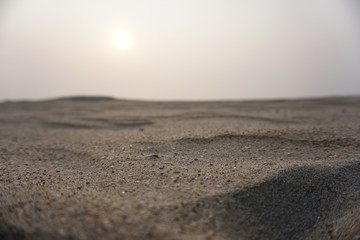 closeup of sand on a beach during sunset in cox's bazar bangladesh