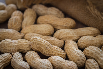 Roasted peanuts on wooden table