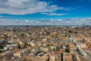 Fototapeta na wymiar City of Bordeaux, France. View from above. View on the roofs of the houses of the French old town. 