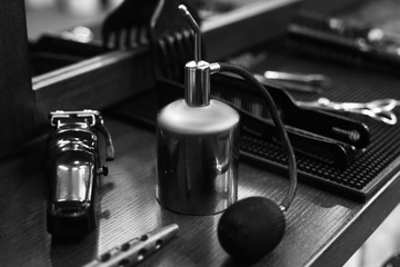The workplace of the barber. Tools for a hairstyle. Black and white image.