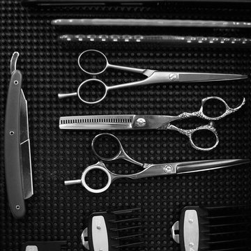 The workplace of the barber. Tools for a hairstyle. Black and white image.