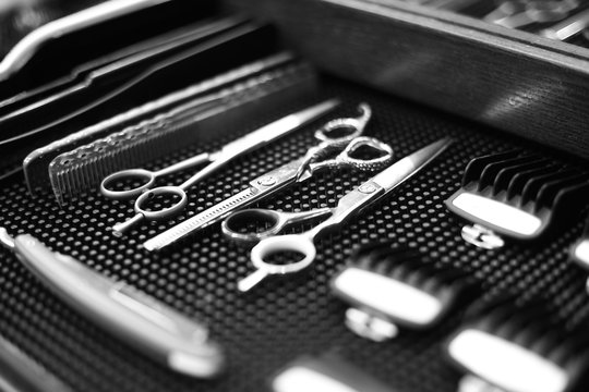 The workplace of the barber. Tools for a hairstyle. Black and white image.