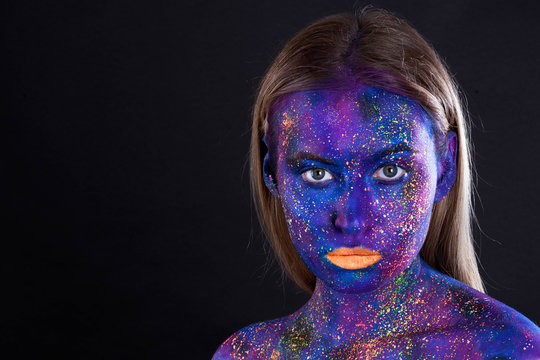 girl in black paint and neon powder
