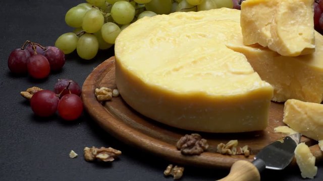 Whole round Head parmesan cheese, wine and grapes
