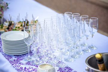Beautiful table setting with crockery and flowers for a party, wedding reception or other festive event.