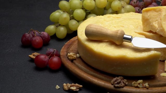 Whole round Head parmesan cheese, wine and grapes